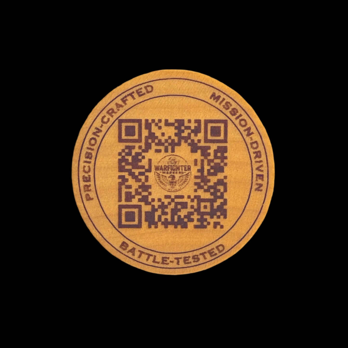 Round wood disc with QR code and text on a black background