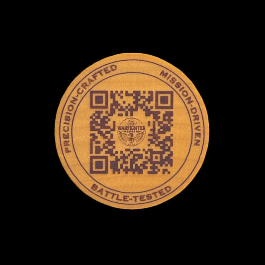 Round wood disc with QR code and text on a black background