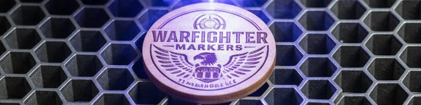Collection of Warfighter Markers with QR code on the back, on a rack